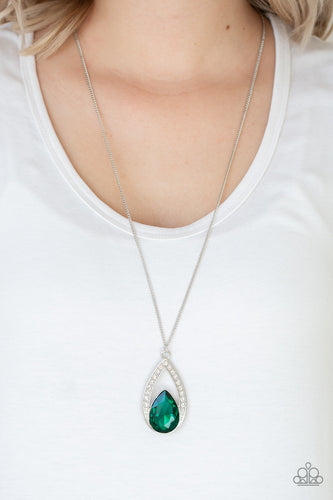 A glittery green teardrop gem is pressed into a silver frame radiating with glassy white rhinestones. The glamorous pendant swings from the bottom of a shimmery silver chain for a refined look. Features an adjustable clasp closure.  Sold as one individual necklace. Includes one pair of matching earrings.  Always nickel and lead free.