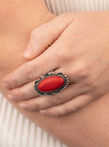 A fiery red stone is pressed into an ornate silver frame rippling with studded and serrated textures for a seasonal flair. Features a stretchy band for a flexible fit.  Sold as one individual ring.