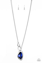 Load image into Gallery viewer, A faceted blue gem is nestled inside of a shimmery silver frame encrusted in dainty white rhinestones. The glittery pendant asymmetrically links with abstract silver frames at the bottom of a lengthened silver rounded snake chain for a modern look. Features an adjustable clasp closure.  Sold as one individual necklace. Includes one pair of matching earrings.