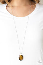 Load image into Gallery viewer, Swinging from the bottom of a lengthened silver satellite chain, an earthy yellow stone is pressed into the center of a sleek silver frame for a tranquil look. Features an adjustable clasp closure.  Featured inside The Preview at ONE Life!   Sold as one individual necklace. Includes one pair of matching earrings.   Always nickel and lead free.   EXCLUSIVE!