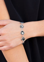 Load image into Gallery viewer, Necklace and Earrings:  Featuring shimmery silver frames, imperfect smoky gems link below the collar for a glamorous vintage inspired look. Features an adjustable clasp closure.  Bracelet:  Featuring shimmery silver frames, imperfect smoky gems link around the wrist for a glamorous vintage inspired look. Features an adjustable clasp closure.  Sold as one individual necklace, set of earrings, and bracelet.