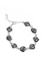 Load image into Gallery viewer, Necklace and Earrings:  Featuring shimmery silver frames, imperfect smoky gems link below the collar for a glamorous vintage inspired look. Features an adjustable clasp closure.  Bracelet:  Featuring shimmery silver frames, imperfect smoky gems link around the wrist for a glamorous vintage inspired look. Features an adjustable clasp closure.  Sold as one individual necklace, set of earrings, and bracelet.