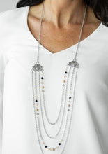 Load image into Gallery viewer, Attached to two ornate floral silver fittings, shimmery silver chains and strands of polished brown, black, and glassy crystal-like beads cascade across the chest for a whimsically layered look. Features an adjustable clasp closure.  Sold as one individual necklace. Includes one pair of matching earrings.