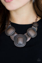 Load image into Gallery viewer, Radiating with geometric and linear details, ornate copper plates link below the collar for a bold tribal look. Features an adjustable clasp closure.  Sold as one individual necklace. Includes one pair of matching earrings.  Always nickel and lead free.  Life of the Party Exclusive October 2018