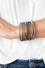 Load image into Gallery viewer, Featuring smooth, studded, hammered, and textured finishes, a mismatched collection of copper, brass, and silver bangles stack across the wrist for a seasonal look.  Sold as one set of nine bracelets.  Always nickel and lead free.