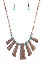 Load image into Gallery viewer, Etched in shimmery textures, glistening copper plates trickle along the bottom of a copper chain, creating a tribal inspired fringe below the collar. Refreshing turquoise stone beads trickle between the antiqued plates, adding an artisanal flair to seasonal palette. Features an adjustable clasp closure.  Sold as one individual necklace. Includes one pair of matching earrings.