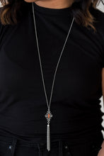 Load image into Gallery viewer, Brushed in an antiqued shimmer, ornate silver beads coalesce into an artisan inspired pendant. Infused with an orange beaded center, the colorful pendant gives way to a shimmery silver tassel for a seasonal finish. Features an adjustable clasp closure.  Sold as one individual necklace. Includes one pair of matching earrings.