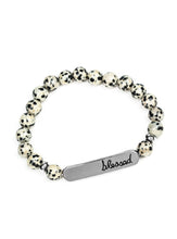 Load image into Gallery viewer, A collection of speckled stones, dainty silver beads, and a silver plate stamped with the inspirational word, "blessed", are threaded along a stretchy band around the wrist for a seasonal look.  Sold as one individual bracelet.
