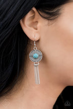 Load image into Gallery viewer,   A refreshing turquoise stone is pressed into a round silver disc that is decorated in linear textures. A tassel of silver chains falls from the bottom of the silver disc, resulting in a design reminiscent of a dreamcatcher. Earring attaches to a standard fishhook fitting.  Sold as one pair of earrings.    Simply Santa Fe Fashion Fix  January 2019   Always nickel and lead free.
