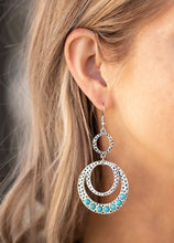 Load image into Gallery viewer, An antiqued collection of hammered silver hoops link into a rustic lure. Dainty turquoise stone beads dot the bottom of the lowermost hoop, adding refreshing pops of color to the seasonal palette. Earring attaches to a standard fishhook fitting.