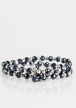 Load image into Gallery viewer, Brushed in a metallic sheen, glittery blue crystal-like beads and faceted silver beads are threaded along stretchy elastic bands. Matching beads swing from the wrist, creating clustered centerpieces.