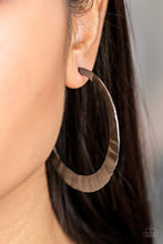 Load image into Gallery viewer, Brushed in a high-sheen finish, a delicately hammered silver hoop curls around the ear for a fierce look. Earring attaches to a standard post fitting. Hoop measures 2 1/2&quot; in diameter.  Sold as one pair of hoop earrings. Always nickel and lead free.