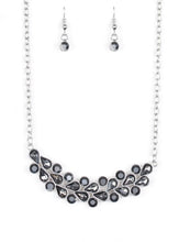Load image into Gallery viewer, A collection of round and teardrop hematite and smoky rhinestones coalesce into a bowing silver pendant below the collar for a refined look. Features an adjustable clasp closure.  Sold as one individual necklace. Includes one pair of matching earrings.