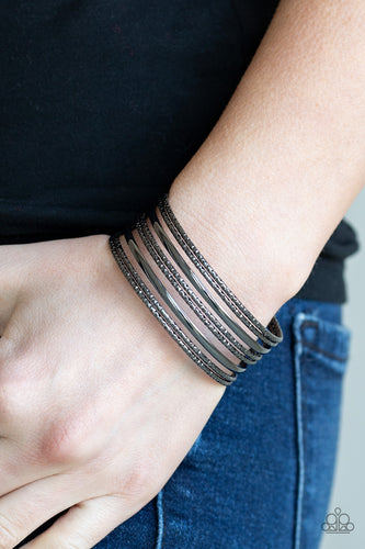 Featuring smooth and diamond-cut finishes, a variation of shimmery gunmetal bars stack across the wrist, coalescing into a casual cuff.  Sold as one individual bracelet.  Always nickel and lead free.
