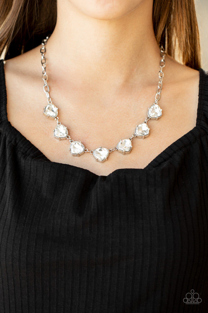Attached to an oversized silver chain, faceted white teardrop frames delicately connect below the collar for a glamorous look. Features an adjustable clasp closure.  Sold as one individual necklace. Includes one pair of matching earrings.  Always nickel and lead free.