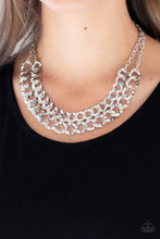Load image into Gallery viewer, Asymmetrical silver frames connect below the collar, creating a bold web-like fringe for a statement-making look. Features an adjustable clasp closure.  Sold as one individual necklace. Includes one pair of matching earrings.  Always nickel and lead free.  Life of the Party Exclusive June 2019