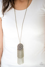 Load image into Gallery viewer, An ornate brass floral pendant swings from the bottom of an elongated brass chain. Brushed in an antiqued shimmer, brass chains stream from the bottom of the floral pendant for a whimsical finish. Features an adjustable clasp closure.  Sold as one individual necklace. Includes one pair of matching earrings.