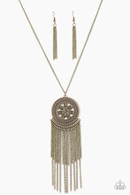 Load image into Gallery viewer, An ornate brass floral pendant swings from the bottom of an elongated brass chain. Brushed in an antiqued shimmer, brass chains stream from the bottom of the floral pendant for a whimsical finish. Features an adjustable clasp closure.  Sold as one individual necklace. Includes one pair of matching earrings.