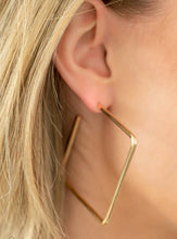 Load image into Gallery viewer,  A deceptively simple square frame is tilted on point to create a geometric hoop. Its sharp angles are complemented by its rich gold finish, making a lasting impression. Earring attaches to a standard post fitting. Hoop measures approximately 2" in diameter.