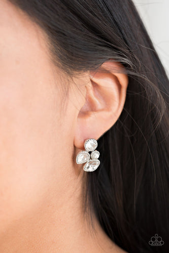 Infused with a dainty white pearl, mismatched white rhinestones coalesce into a glittery frame. Earring attaches to a standard post fitting.  Sold as one pair of post earrings.  Always nickel and lead free.