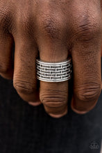 Load image into Gallery viewer, Brushed in an antiqued finish, abstract bar-like patterns are stamped across the front of a thick silver band for a casual look. Features a stretchy band for a flexible fit.  Sold as one individual ring.  Always nickel and lead free.
