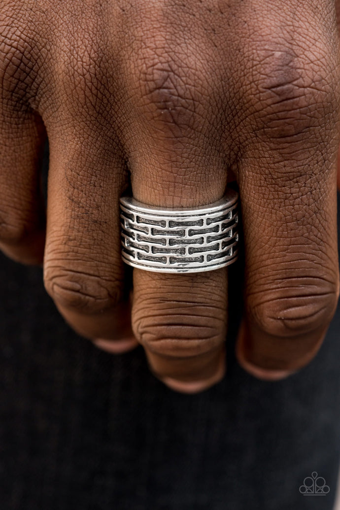 Brushed in an antiqued finish, abstract bar-like patterns are stamped across the front of a thick silver band for a casual look. Features a stretchy band for a flexible fit.  Sold as one individual ring.  Always nickel and lead free.
