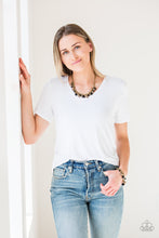Load image into Gallery viewer, Necklace and Earrings:  Pearly brass, polished black, and glittery crystal-like beads swing from a bold brass chain, creating a refined fringe below the collar. Features an adjustable clasp closure.  Bracelet:  Pearly brass, polished black, and glittery crystal-like beads swing from a bold brass chain, creating a refined fringe around the wrist. Features an adjustable clasp closure.
