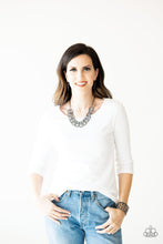 Load image into Gallery viewer, Necklace and Earrings:  Etched and hammered in linear and diamond-cut shimmer, glistening gunmetal circles interlock into a bold industrial chain below the collar. Features an adjustable clasp closure.  Bracelet:  Etched and hammered in linear and diamond-cut shimmer, glistening gunmetal circles join into a dramatic cuff around the wrist.  Sold as one individual necklace, matching earrings, and bracelet.   Always nickel and lead free.