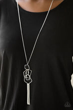 Load image into Gallery viewer, Glistening silver bars bend into airy pentagon shaped frames as they trickle from the bottom of an elongated gunmetal chain, creating an edgy clustered pendant. A shiny silver tassel swings from the trendy geometric pendant for a flirtatious finish. Features an adjustable clasp closure.  Sold as one individual necklace. Includes one pair of matching earrings.  Always nickel and lead free.