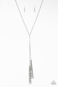 Dainty silver pearls and sparkling white crystal-like beads gives way to two shimmery silver chain tassels. Infused with ornate silver beads, strands of matching beads trickle down the tassels for a refined flair. Features an adjustable clasp closure.  Sold as one individual necklace. Includes one pair of matching earrings.  Always nickel and lead free.