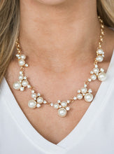 Load image into Gallery viewer, Clusters of pearls and dazzling white rhinestones join below the collar, creating refined frames. Infused with a glistening gold chain, the sections of luminescent frames trickle along the neck in a timeless fashion. Features an adjustable clasp closure.  Sold as one individual necklace. Includes one pair of matching earrings.  Life of the Party Exclusive