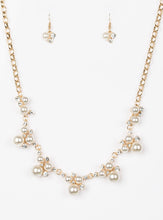 Load image into Gallery viewer, Clusters of pearls and dazzling white rhinestones join below the collar, creating refined frames. Infused with a glistening gold chain, the sections of luminescent frames trickle along the neck in a timeless fashion. Features an adjustable clasp closure. Sold as one individual necklace. Includes one pair of matching earrings. Life of the Party Exclusive