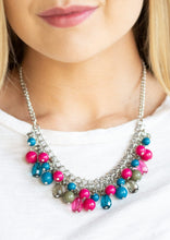 Load image into Gallery viewer, Varying in shape, glassy and polished blue, green, and pink beads swing from the bottom of interlocking silver chains. Crystal-like teardrops are sprinkled along the colorful beading, creating a flirtatious fringe below the collar. Features an adjustable clasp closure.  Sold as one individual necklace. Includes one pair of matching earrings.
