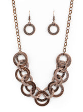Load image into Gallery viewer, Brushed in an antiqued shimmer, delicately hammered copper discs connect below the collar for a bold industrial look. Features an adjustable clasp closure.  Sold as one individual necklace. Includes one pair of matching earrings.  Always nickel and lead free.       