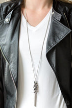 Load image into Gallery viewer, Twinkling metallic and black beads are threaded along dainty silver rods, creating a sparkling fringe at the bottom of a lengthened silver chain. A shimmery silver tassel extends from the bottom for an edgy finish.  Sold as one individual necklace. Includes one pair of matching earrings.  Always nickel and lead free.