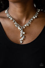 Load image into Gallery viewer, A charming collection of white pearls, glassy crystal-like beads, and ornate silver heart charms dangle below the collar. Featuring matching beads, an extended silver chain drips from the center for a vintage inspired look. Features an adjustable clasp closure.  Sold as one individual necklace. Includes one pair of matching earrings.  Always nickel and lead free.