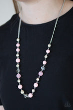 Load image into Gallery viewer, Classic silver beads and glittery crystal-like beads trickle along the bottom of a shimmery silver chain. Varying in opacity, pretty pink beads are sprinkled between the refined accents for a seasonal finish. Features an adjustable clasp closure.  Sold as one individual necklace. Includes one pair of matching earrings.   Always nickel and lead free.