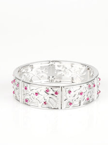 Filled with vine-like filigree, shimmery silver frames are threaded along stretchy bands around the wrist for a whimsical look. Dainty pink rhinestones are sprinkled along the ornate frames for a sparkling finish.  Sold as one individual bracelet.