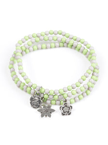 ﻿Dainty green and gray beads are threaded along stretchy elastic bands, creating colorful layers across the wrist. Brushed in an antiqued shimmer, dainty floral charms swing from the wrist for a seasonal finish.  Sold as one set of three bracelets.  