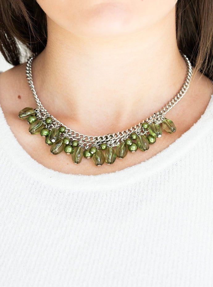 A collection of glassy and pearly green beads dangle from the bottom of interconnected silver chains, creating a flirtatious fringe below the collar. Features an adjustable clasp closure.  Sold as one individual necklace. Includes one pair of matching earrings. 
