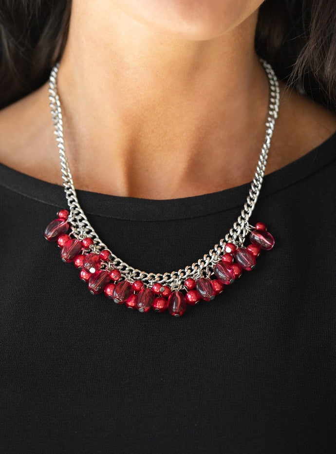 A collection of glassy and pearly red beads dangle from the bottom of interconnected silver chains, creating a flirtatious fringe below the collar. Features an adjustable clasp closure.  Sold as one individual necklace. Includes one pair of matching earrings.  Always nickel and lead free.
