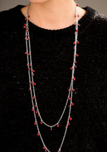 Load image into Gallery viewer, Varying in size, classic red pearls cascade along shimmery silver chains, creating a glamorous fringe. Features an adjustable clasp closure.  Sold as one individual necklace. Includes one pair of matching earrings.  Always nickel and lead free.
