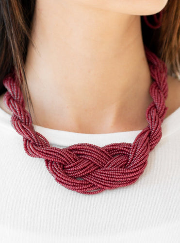 Countless strands of wine red seed beads are twisted and knotted together to create an unforgettable statement piece. Features an adjustable clasp closure.  Sold as one individual necklace. Includes one pair of matching earrings.  Always nickel and lead free.