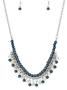 Infused with silver chain, blue pearls are threaded along an invisible wire below the collar. Matching blue pearls and glittery white rhinestones swing from the pearly strand, creating a flirtatious fringe below the collar. Features an adjustable clasp closure.  Sold as one individual necklace. Includes one pair of matching earrings.  Always nickel and lead free.