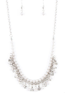 Infused with silver chain, silver pearls are threaded along an invisible wire below the collar. Matching silver pearls and glittery white rhinestones swing from the pearly strand, creating a flirtatious fringe below the collar. Features an adjustable clasp closure.  Sold as one individual necklace. Includes one pair of matching earrings.  Always nickel and lead free.