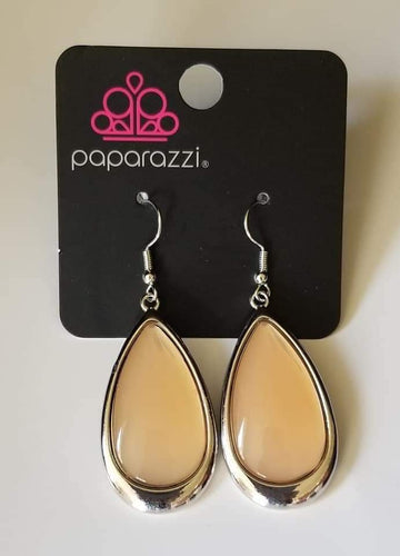 A glassy brown teardrop is nestled inside a glistening silver frame, creating an ethereally elegant lure. Earring attaches to a standard fishhook fitting.  Sold as one pair of earrings.   Always nickel and lead free.  Fashion Fix Exclusive July 2021