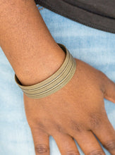 Load image into Gallery viewer, Stamped in tribal inspired patterns, an antiqued brass cuff wraps around the wrist for an indigenous look.  Sold as one individual bracelet.  Always nickel and lead free. 