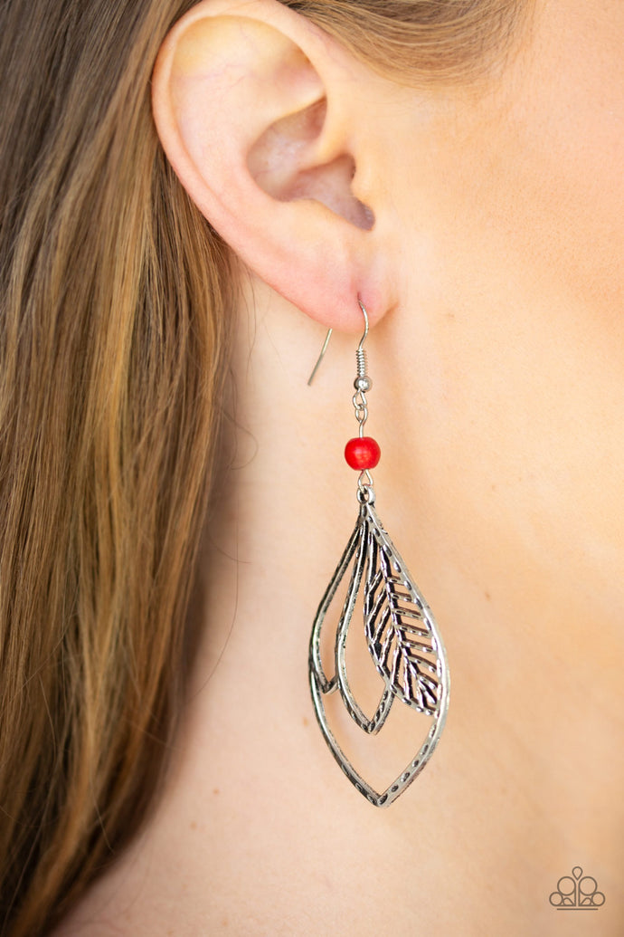 Featuring a hammered antiqued finish, feathery silver frames overlap inside of a silver teardrop frame. The whimsical frame swings from the bottom of a smooth red stone bead for a seasonal finish. Earring attaches to a standard fishhook fitting.  Sold as one pair of earrings.  Always nickel and lead free.