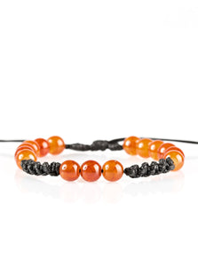 Orange stones are threaded along shiny black twine, creating a seasonal look around the wrist. Features an adjustable sliding knot closure.  Sold as one individual bracelet.