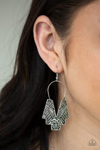 Load image into Gallery viewer, Embossed in tactile tribal inspired patterns, an abstract geometric frame swings from a silver wire fitting for a tribal inspired look. Earring attaches to a standard fishhook fitting.  Sold as one pair of earrings.  Always nickel and lead free.
